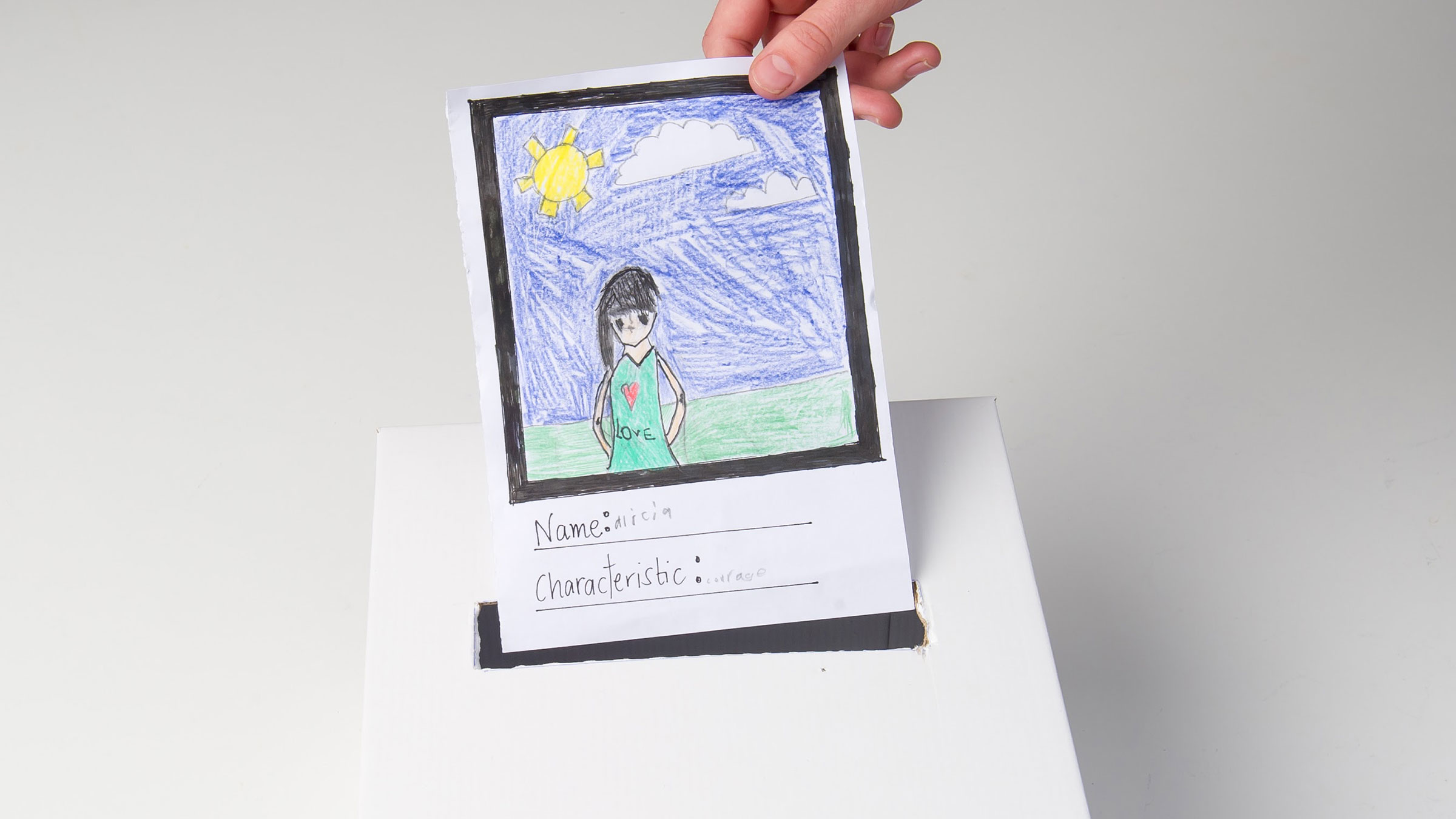 A portrait being posted into a characteristic box.
